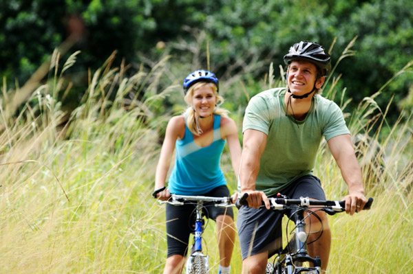 2 people riding bikes